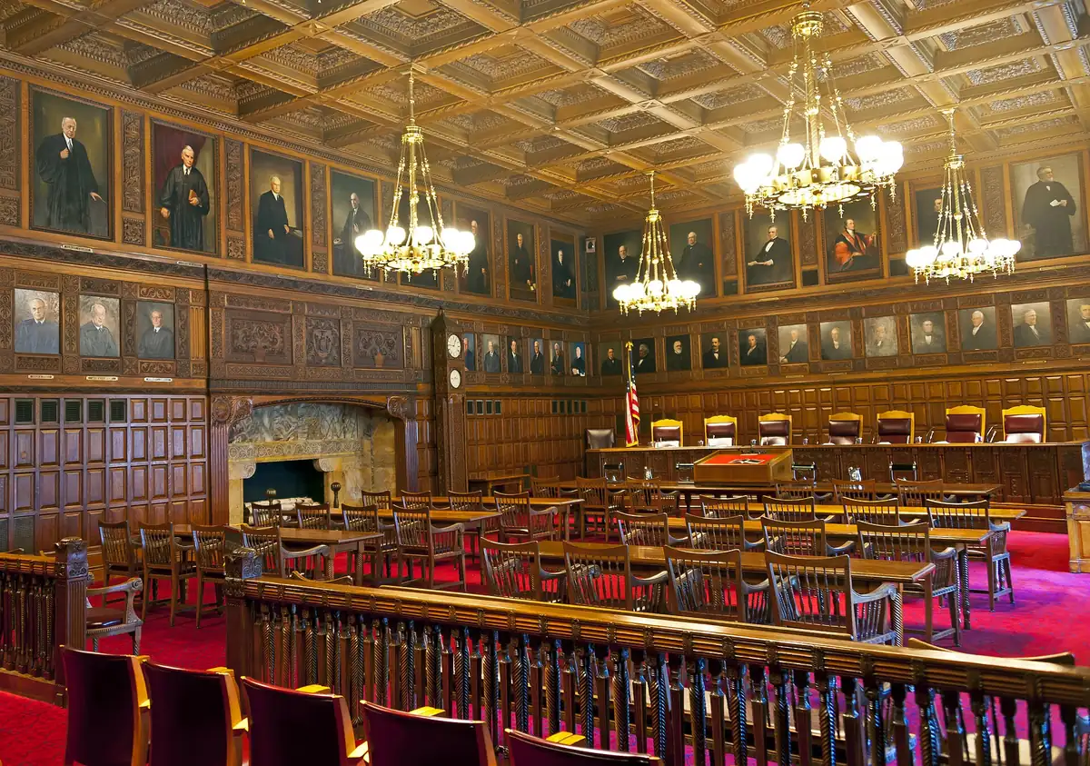 The courtroom of the New York Court of Appeals: a raised bench for seven judges, counsel tables below it, and a public gallery behind.