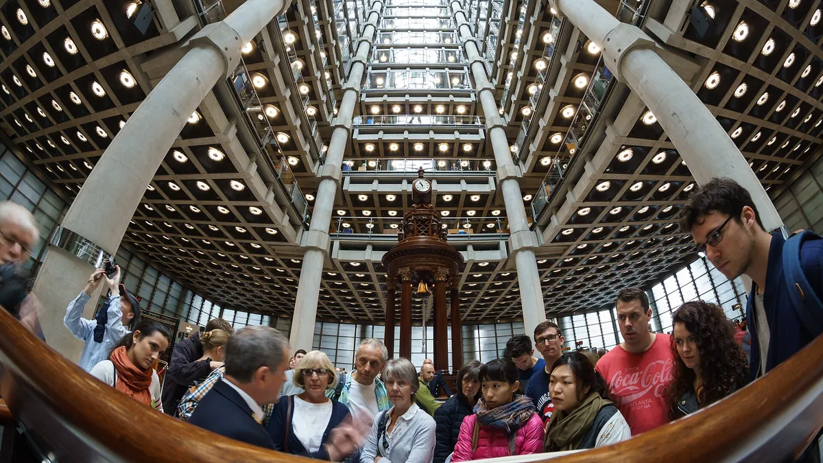 The Underwriting Room at Lloyd's of London: an open floor of syndicate boxes under a high atrium.