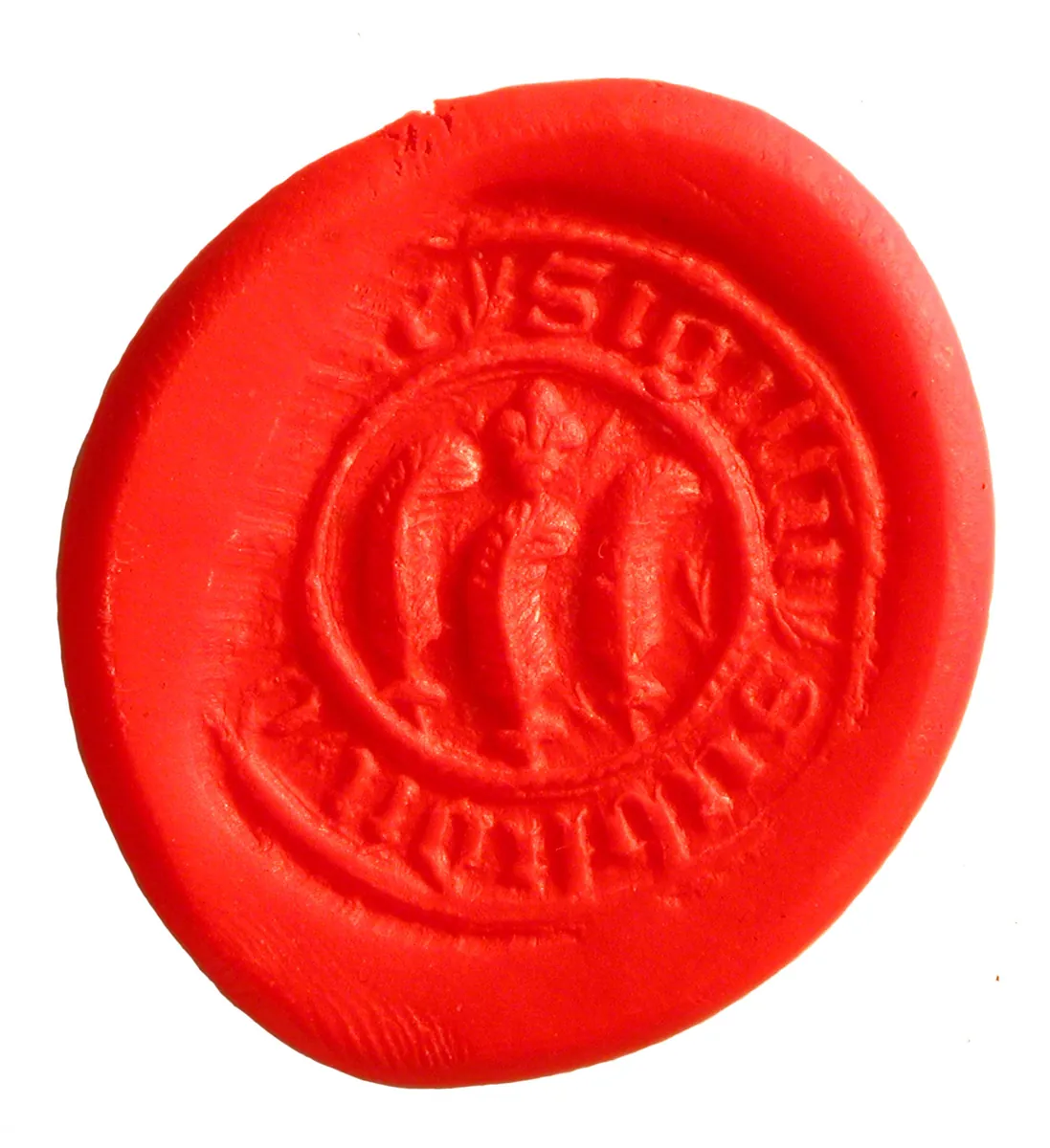 A medieval wax seal impression, the design pressed into the wax still legible.