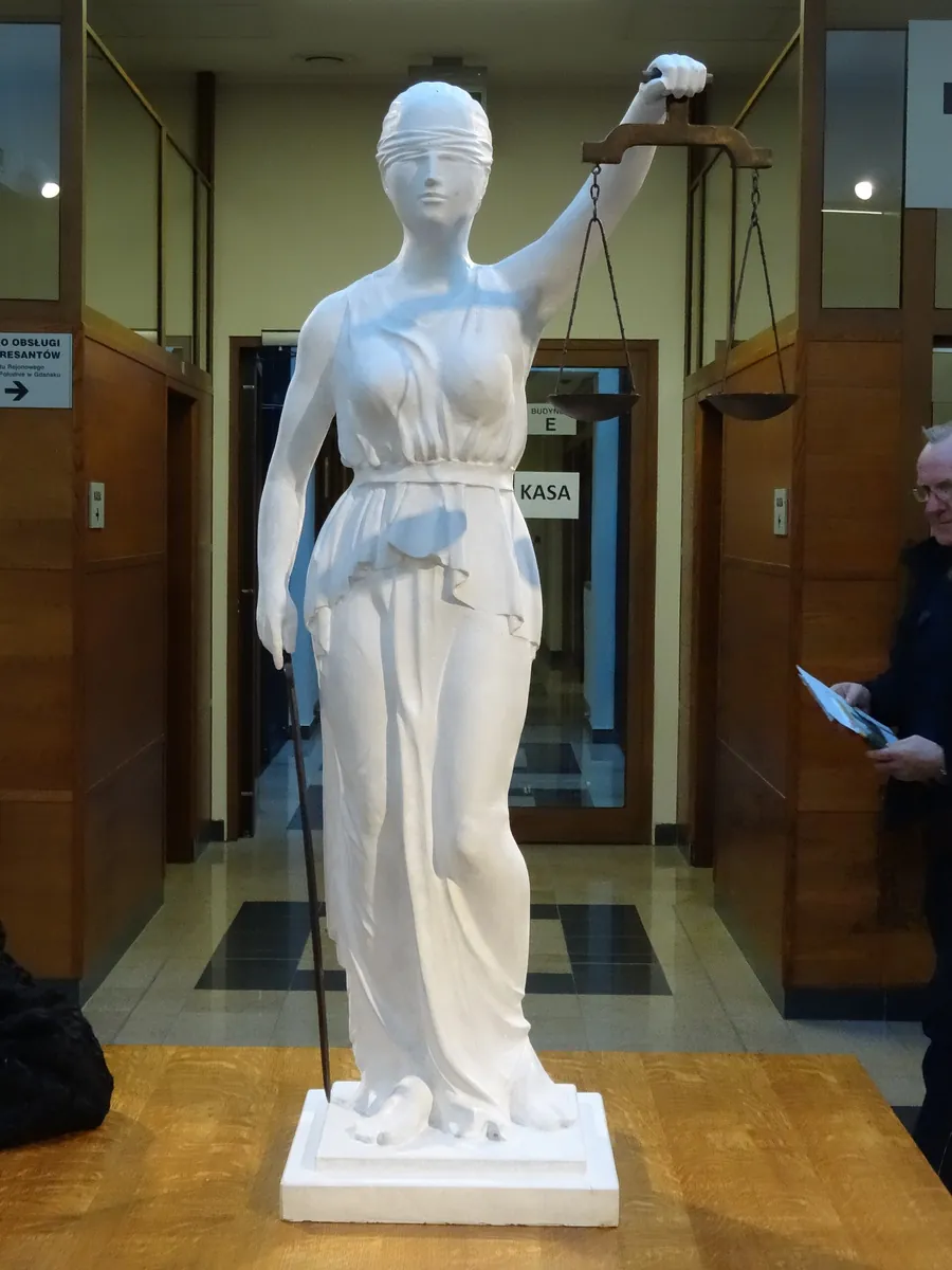A statue of Themis holding scales, outside the court building in Gdańsk.